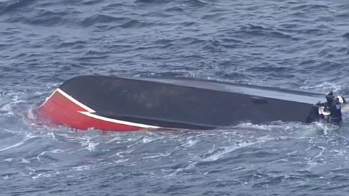 The boat overturned about 7am. (9NEWS)