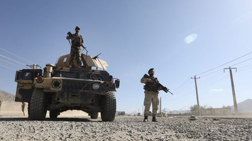 Afghan army soldiers stand guard in a checkpoint during the three-day ceasefire. Picture: EPA