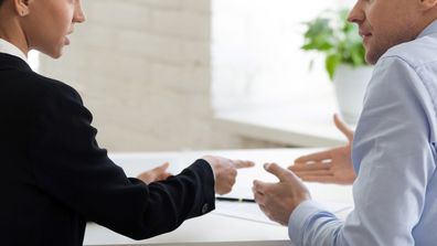 Male and female colleague talking