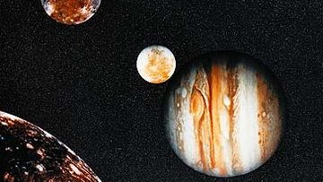 Photograph of Jupiter and its moons from Voyager (Getty)