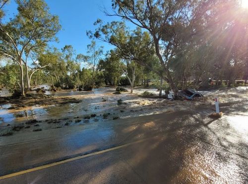 Water is flowing down the Todd River in the Northern Territory.
