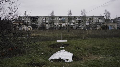 Recently dug graves of residents who died during shelling are seen in Soledar, Donetsk region, Ukraine.