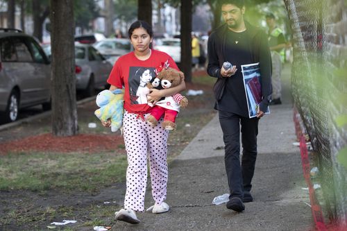 Six children perished in the flames and residents have set up a makeshift memorial with crosses and Micky Mouse dolls.