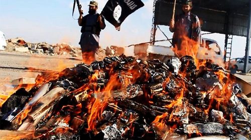 ISIL burn banned cigarettes and alcohol on bonfires