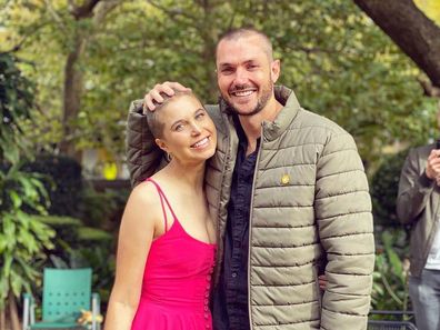 Hannah with Simon after they both shaved their heads.