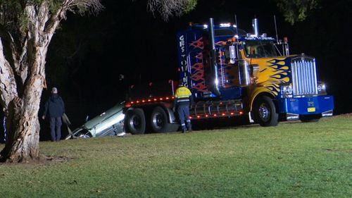 The car was driven through a park, over an embankment and into the river. Picture: 9NEWS