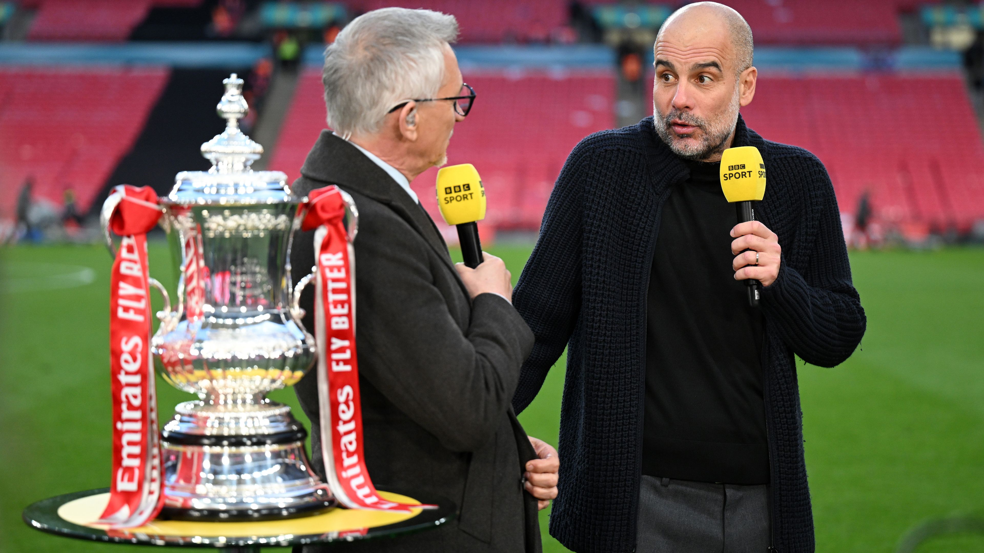 Gary Lineker speaks to Pep Guardiola after Manchester City&#x27;s victory.