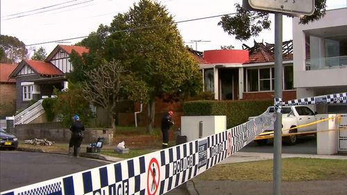 Police have set up a crime scene at the home in Rodd Point.