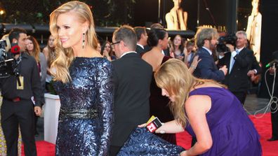 Sonia Kruger being helped with her dress at the Logies in 2013.