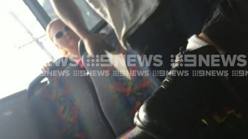 Passengers filmed the man as he wielded the machete. (9NEWS)