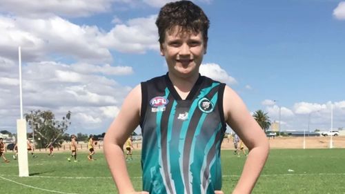 Before his diagnosis, Mitch was a keen Aussie Rules player.