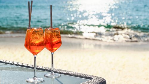 two aperol spritz on a summer evening in a mediterranean restaurant