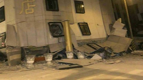 The earthquake has caused the bottom floors of a hotel to collapse. (AAP)