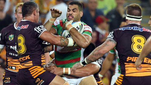South Sydney captain Greg Inglis runs into the Broncos' defence. (AAP)