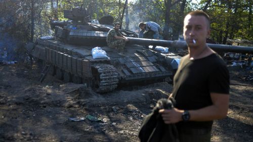 Military reports of Ukrainian soldiers battling Russian tanks