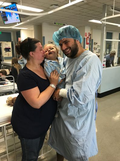 Heart parents with baby after operation