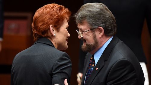 Derryn Hinch and Pauline Hanson speak inside the Senate chamber at Parliament House in Canberra, 2016.