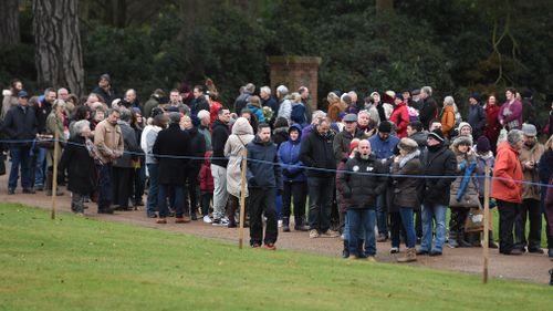 Crowds wait for the arrival of the royal family. (Joe Giddens/PA Wire)