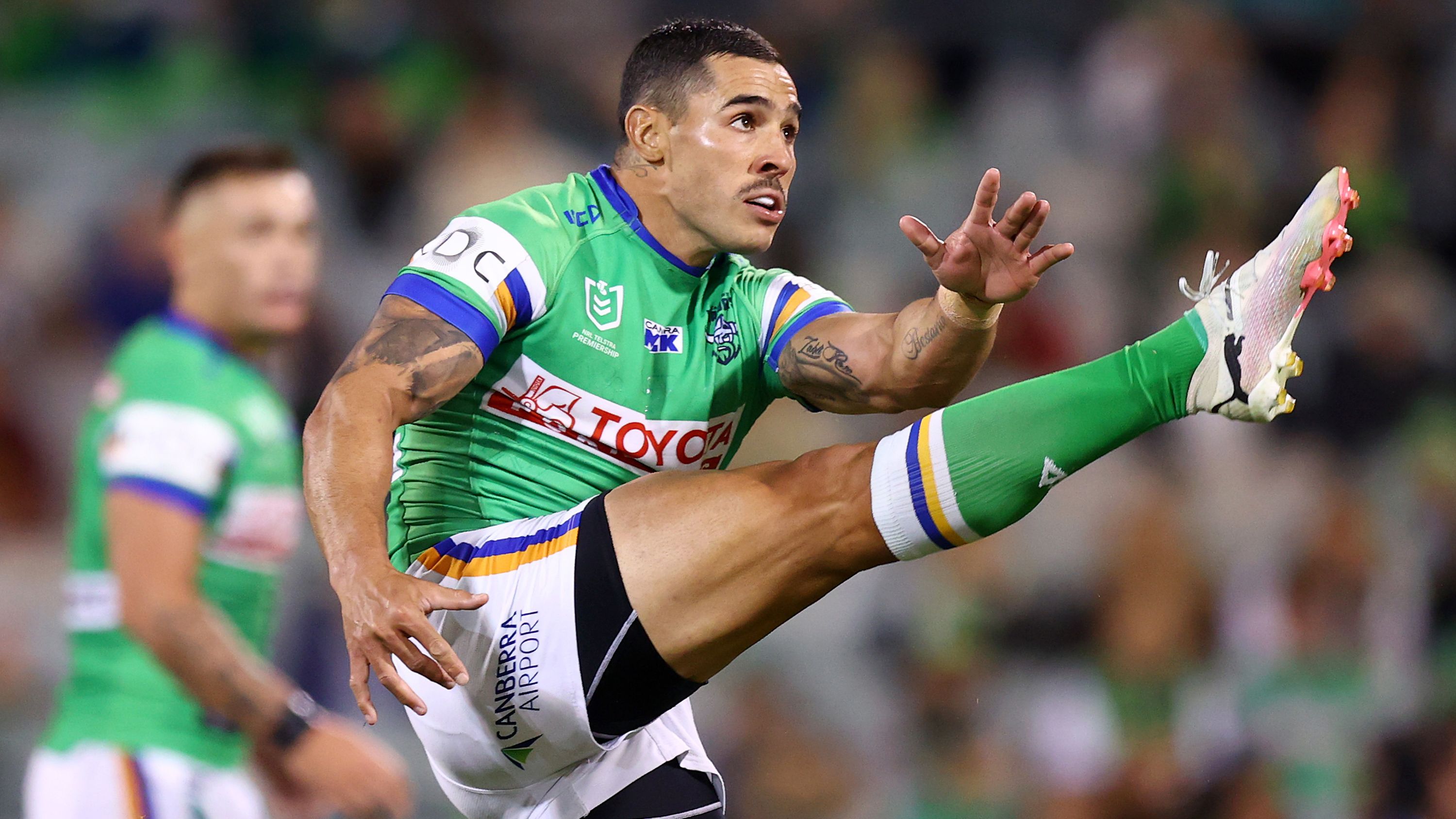 Jamal Fogarty kicks during the match-winning field goal between the Canberra Raiders and the Gold Coast Titans.
