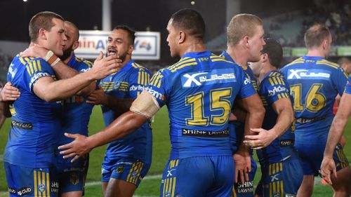 The Eels celebrate their win over the Roosters during their round 18 NRL match between the Parramatta Eels and the Sydney Roosters at Pirtek Stadium in Sydney, on July 8, 2016. (AAP)