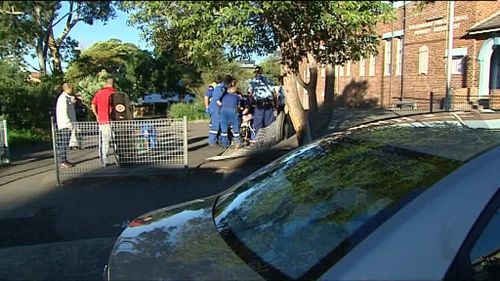 Four adults were hit by the car while waiting to collect their children from school. (9NEWS)