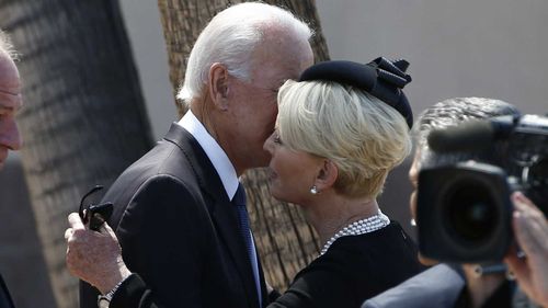 Joe Biden embraces Cindy McCain at her husband John's funeral.