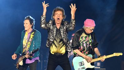  Ronnie Wood, Mick Jagger and Keith Richards of The Rolling Stones perform onstage at Nissan Stadium on October 09, 2021 in Nashville, Tennessee.