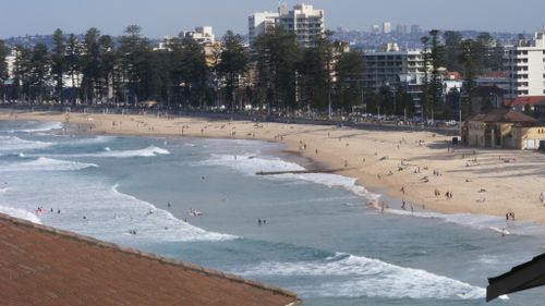 Unconscious man pulled from water at Manly Beach