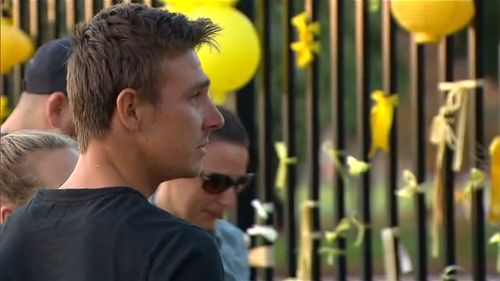 They stopped to read messages left by members of the community. (9NEWS)
