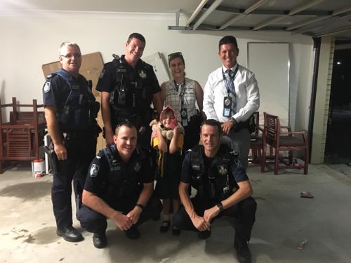 Officers from Beaudesert Police Station with Alyssa after the ordeal. (Facebook) 