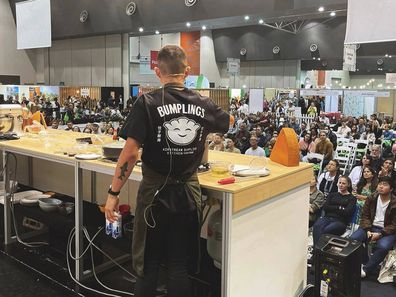 Brendan Pang cooking in front of a live audience.