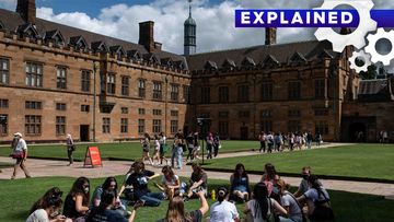 Students are seen walking through the Sydney University&#x27;s campus. 