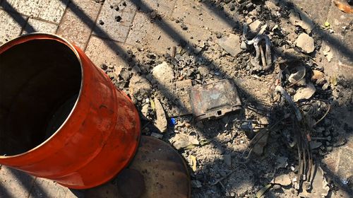 The remains of Aaron Crowe's home, lost in a fire on Friday, is seen dumped on a footpath outside the NSW Parliament following a climate change protest in Sydney.