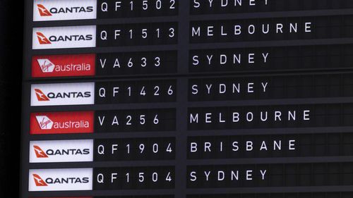 Qantas and Virgin flight details seen on a departure board at Canberra Airport on Thursday 7 September 2023. fedpol Photo: Alex Ellinghausen