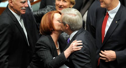 The 'kiss of death' Ms Gillard gave Mr Rudd following the passing of the carbon tax. (Image: AAP)
