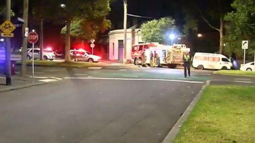 Police at the scene in North Melbourne. (9NEWS)