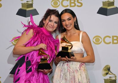 Abigail Barlow and Emily Bear pose in the winners photo room during the 64th Annual Grammy Awards