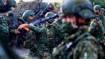 Taiwanese soldiers prepare grenade launchers, machine guns and tanks for the Han Kuang drill for simulation in the event of China&#x27;s invasion. (Photo by Ceng Shou Yi/NurPhoto via AP)