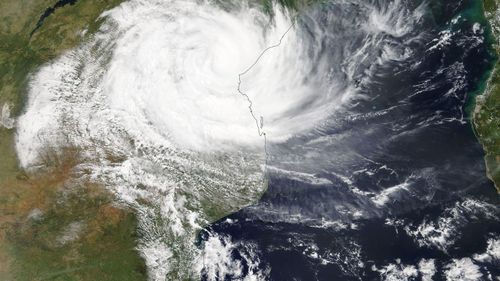 A handout photo made available by the NASA shows a Terra/MODIS satellite image of cyclone Idai as it hits Mozambique.