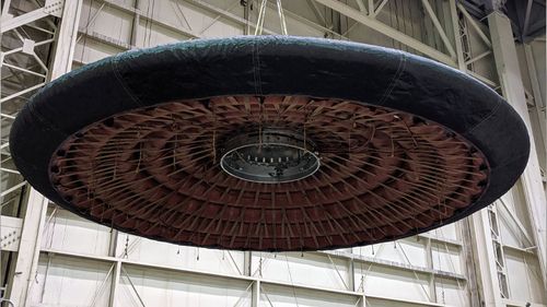 The underside of the inflatable aeroshell can be seen during testing.