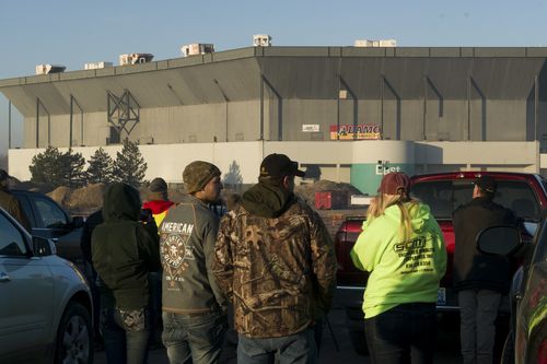 People stand and stare after an attempt a a partial collapse of the Silverdome. (AAP)