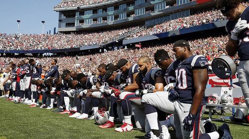 Several New England Patriots players kneel during the national anthem before an NFL football game against the Houston Texans. (AP)