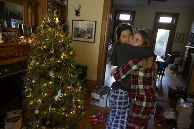 The Rosier family celebrates Christmas with a traditional opening of presents on Christmas morning, December 25, 2019, in Brooklyn, New York. 