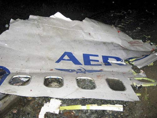 In this photo released by Press Service of Russian Emergencies Ministry in Perm region a fuselage piece of a Boeing-737-500 with the company's name Aeroflot, partly seen, lies at the crash site on the outskirts of the Ural Mountains city, early Sunday, Sept. 14, 2008, shortly after the crash. The Boeing-737-500 passenger jet, which was operated by an Aeroflot subsidiary, traveling from Moscow crashed as it was preparing to land early Sunday, killing all 88 people aboard, officials said Sunday. (AP Photo/Press Service of Russian Emergencies Ministry in Perm region, HO)