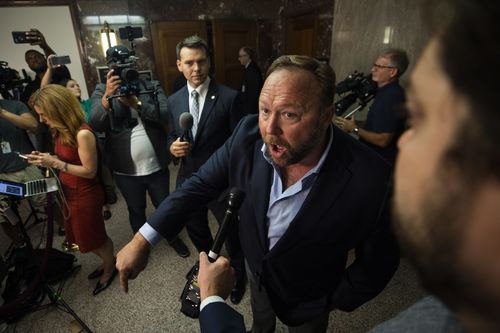 Radio host and conspiracy theorist Alex Jones speaks to the media outside of a Senate Intelligence Committee hearing with CEO of Twitter Jack Dorsey and COO of Facebook Sheryl Sandberg in the Dirksen Senate Office Building in Washington