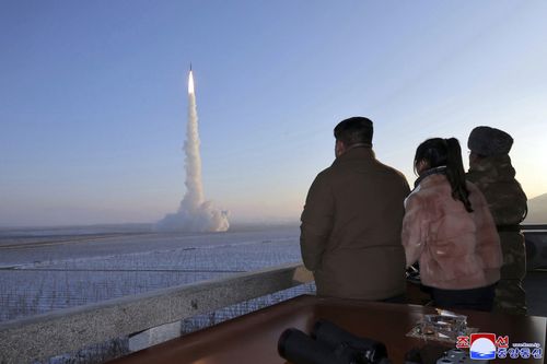 North Korean leader Kim Jong Un watches missile launch.