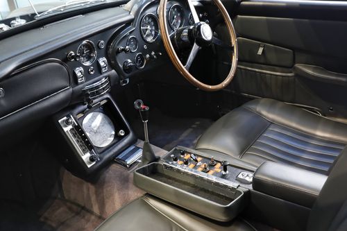 A navigation system and control panel for defense accessories are installed beside the drivers seat of a James Bond 1965 Aston Martin DB5, at Sotheby's in New York, Monday, July 29, 2019. 