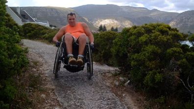 Chris in a wheelchair hiking
