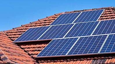 Solar panels on top of house (Getty)