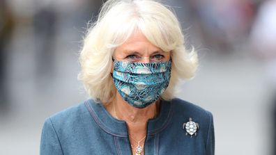 Camilla, Duchess of Cornwall wears a mask with a feather design on July 28, 2020 in London, England